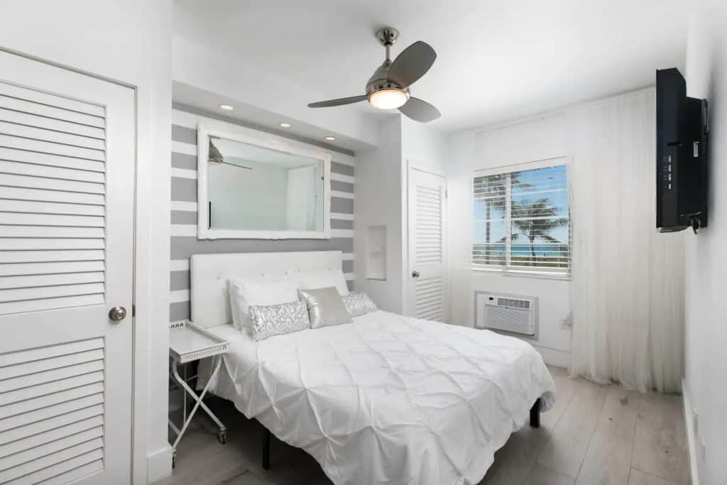 Photo of bedroom inside an epic Ocean Drive oasis Airbnb in Miami.