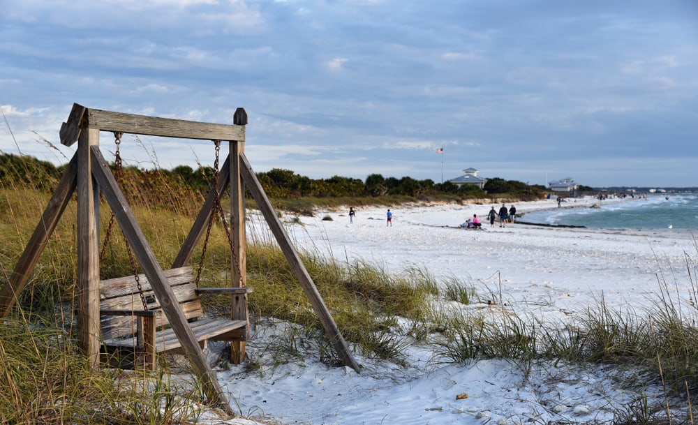 Wooden bench swing on Honeymoon Island, one of the best islands in Florida.