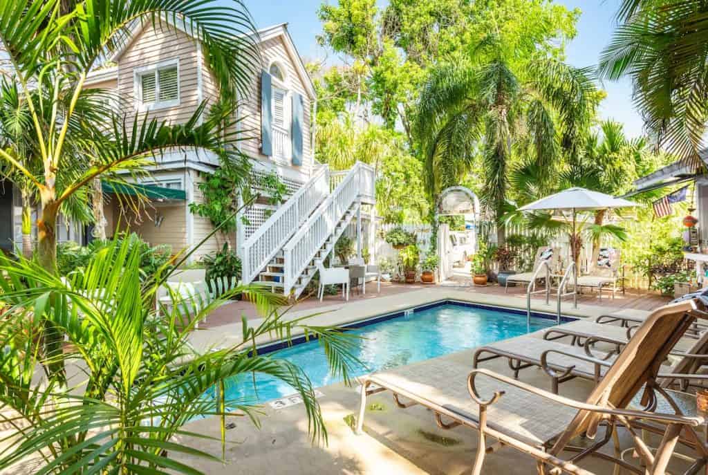 Airbnb in Key West with pool deck with palm trees