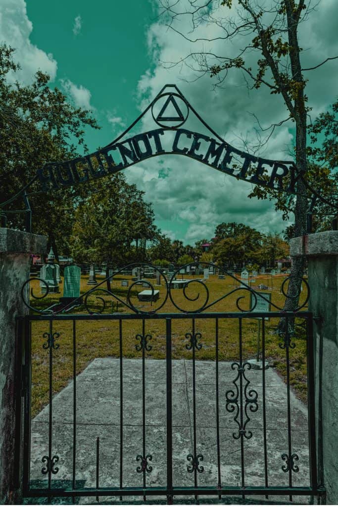 Spooky photo of the gate at Huguenot Cemetery, a stop on many Saint Augustine ghost tours. 