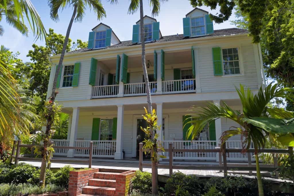Exterior of the historic, white and green, Audubon House, one of the best things to do in Key West.