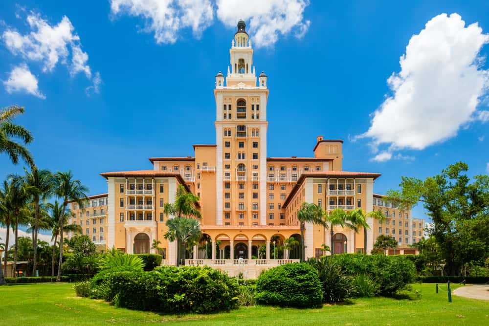 Photo of the impressive orange exterior of the Biltmore Hotel in Miami, one of the most luxurious romantic getaways in Florida.