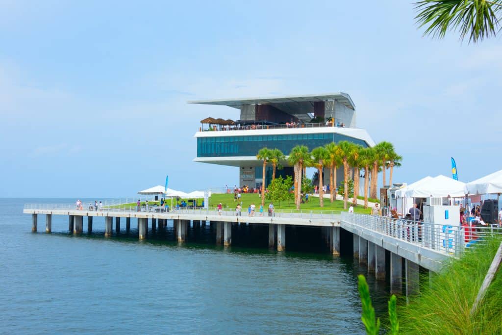The newly renovated St. Pete Pier with a fishing platform, palm trees and several restaurants.