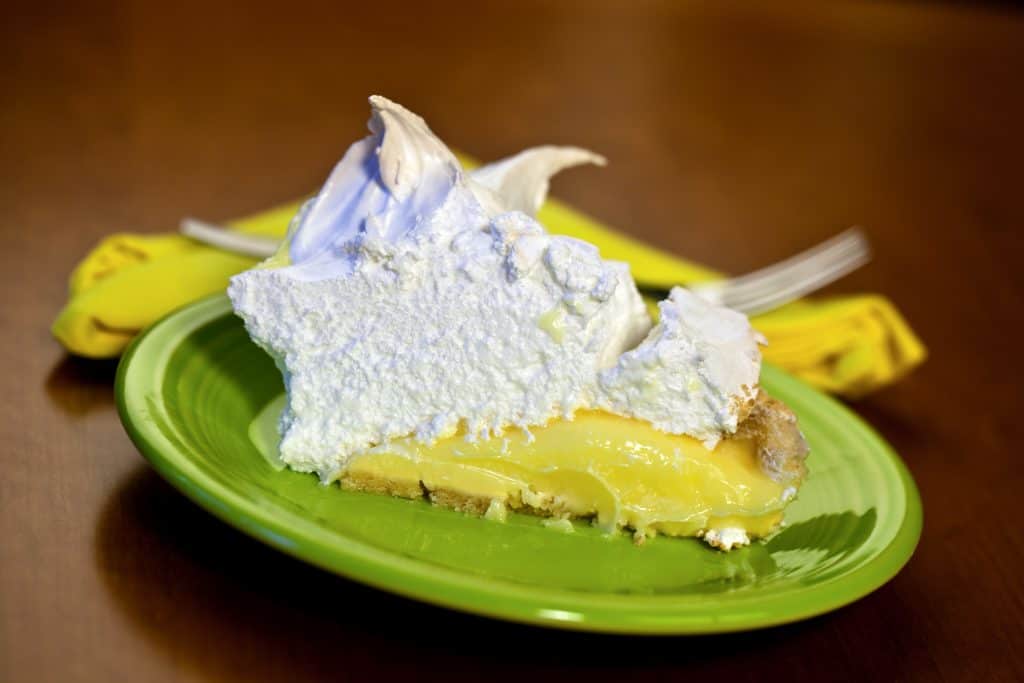 Photo of a slice of Key Lime Pie with meringue. Some of the best Key Lime Pie in Key West is made this way. 