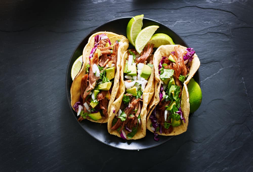 Delicious tacos being served at a mexican style restaurant