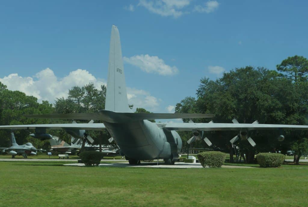 A battle plane sits on the fields at the Air Force Armament Museum.