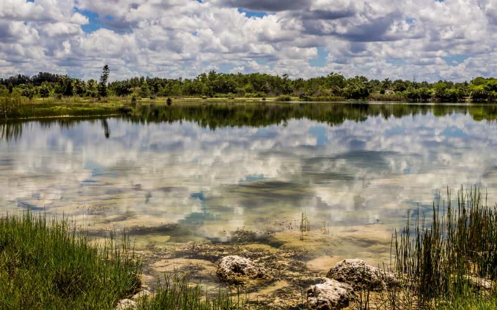 The clear water reflects back a cloud-filled sky at the Everglades nati