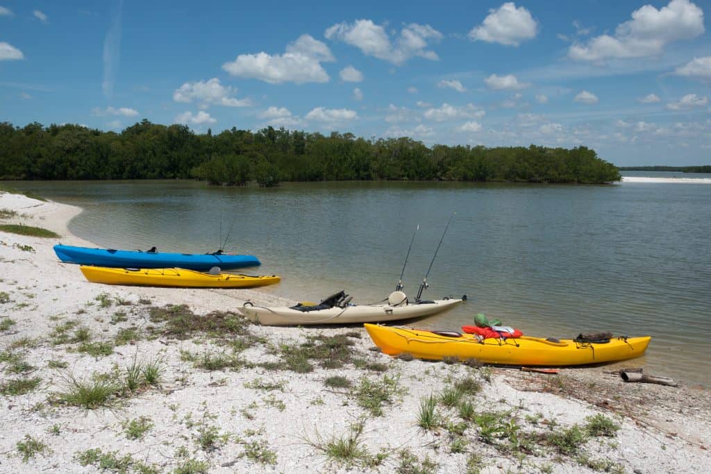 Kayaks rest on the shore of the Ten Thousand Islands, one of the best Everglades attractions. 