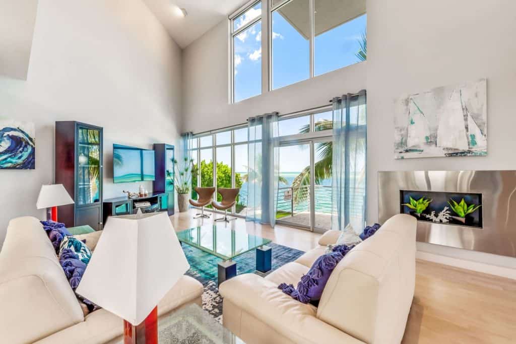 Photo of the living room with a beach view inside the Modern Marvel Airbnb property in Sarasota. 