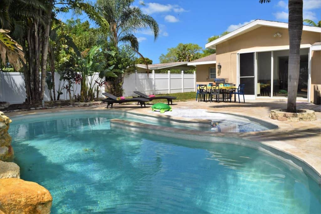 Photo of the pool and backyard at an Airbnb in Sarasota. 