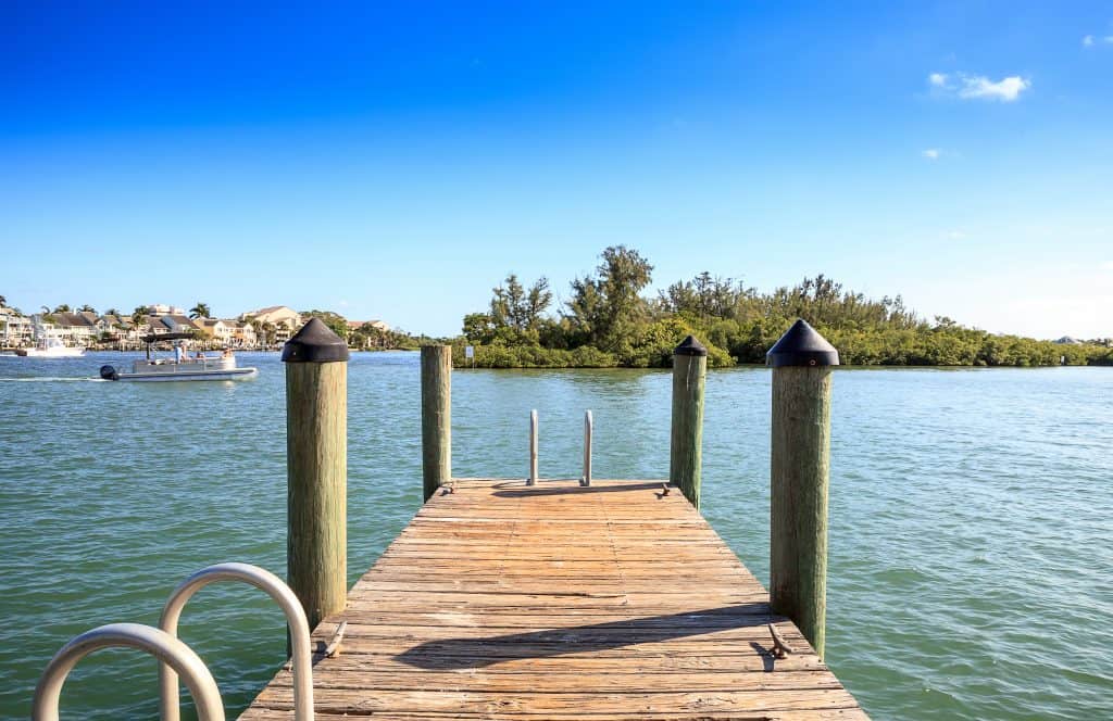 A dock looks out onto the gentle waters of Sawfish Bay Park.