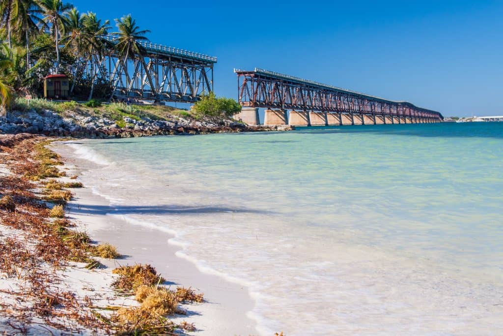 The bridge at Bahia Honda can be seen from the shoreline, a perfect stop on your next Florida road trip.