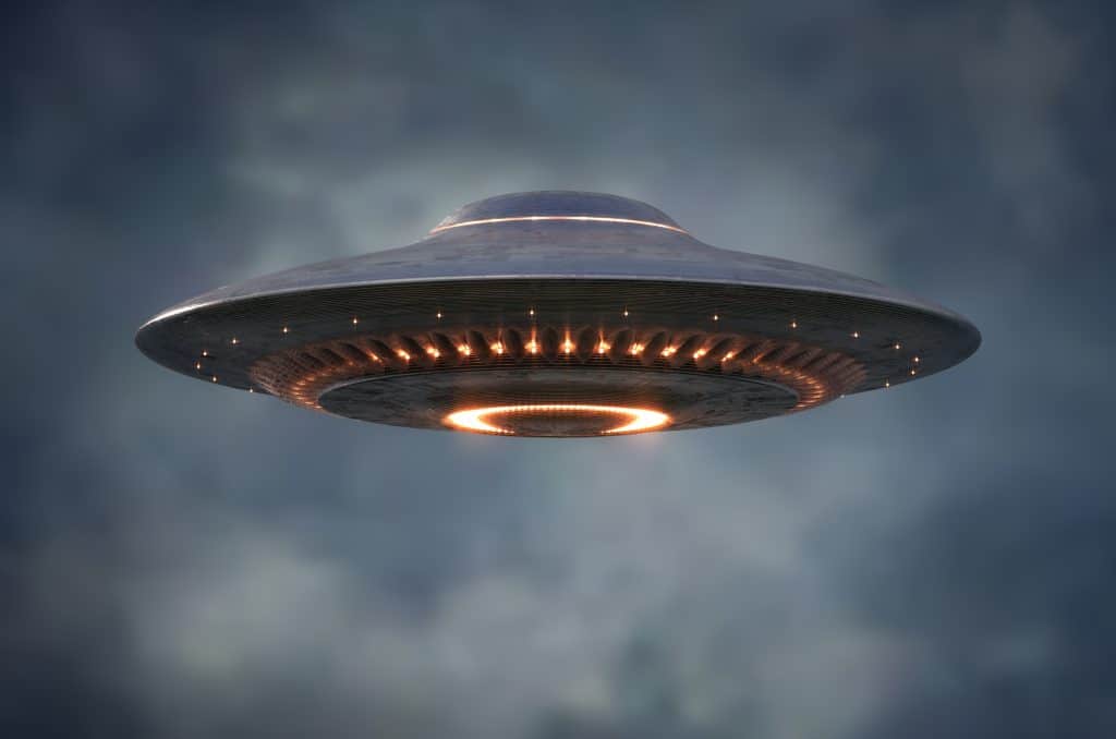 An unidentified flying object hovers in the sky, something you might see on your Florida road trip.