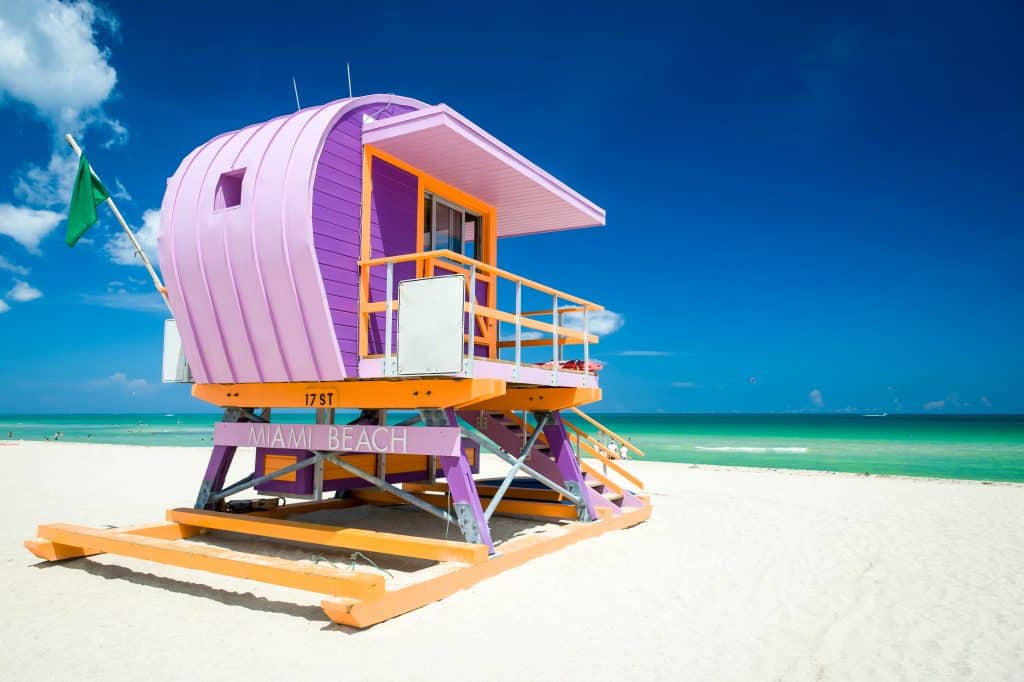 A colorful lifeguard house sits on South Beach, one of the best Miami nude beaches. 