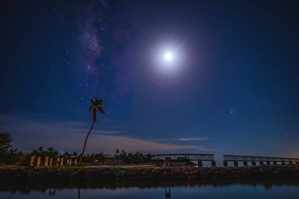 The stars and the moon shine down on Bahia Honda, one of the best places to see stars in Florida.