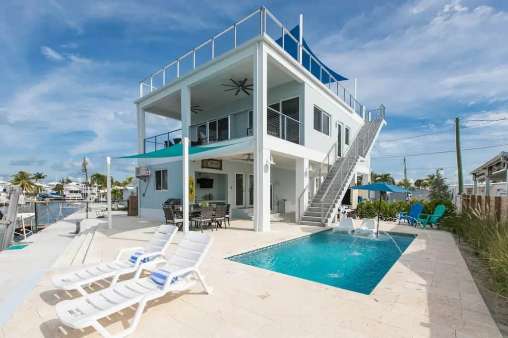 Photo of a 2 story Airbnb in Florida with a pool. 