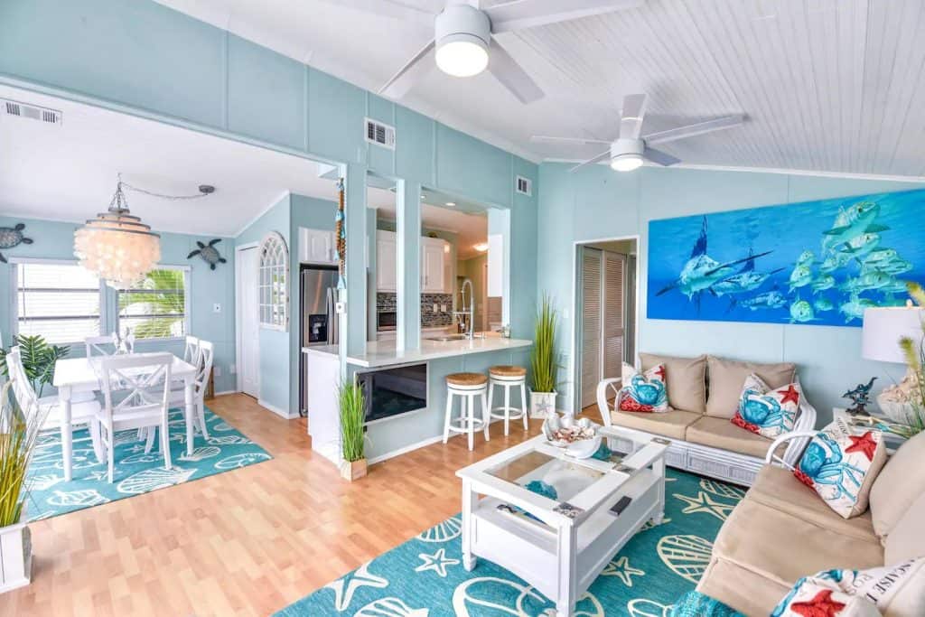 Photo of the tropical themed living room and dining room at an Airbnb named Atlantis.