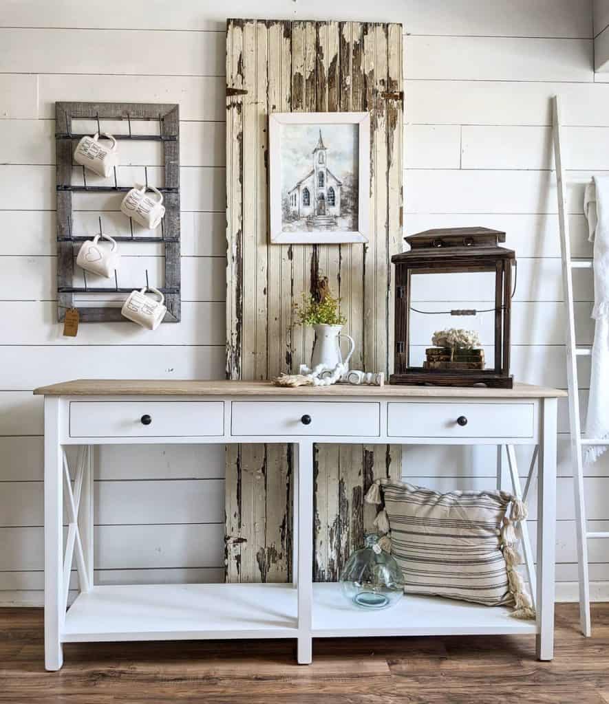 A white console and a pair of salvaged cabinet doors on display at the Rehab Vintage Market.