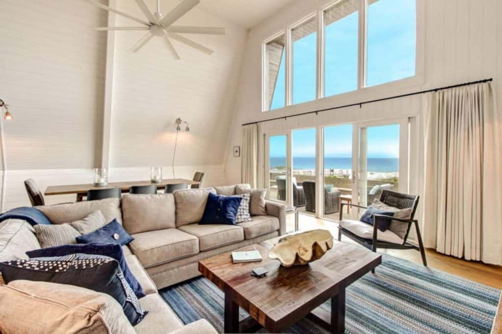 Photo of the living room and oceanfront view inside an Airbnb on Amelia Island.