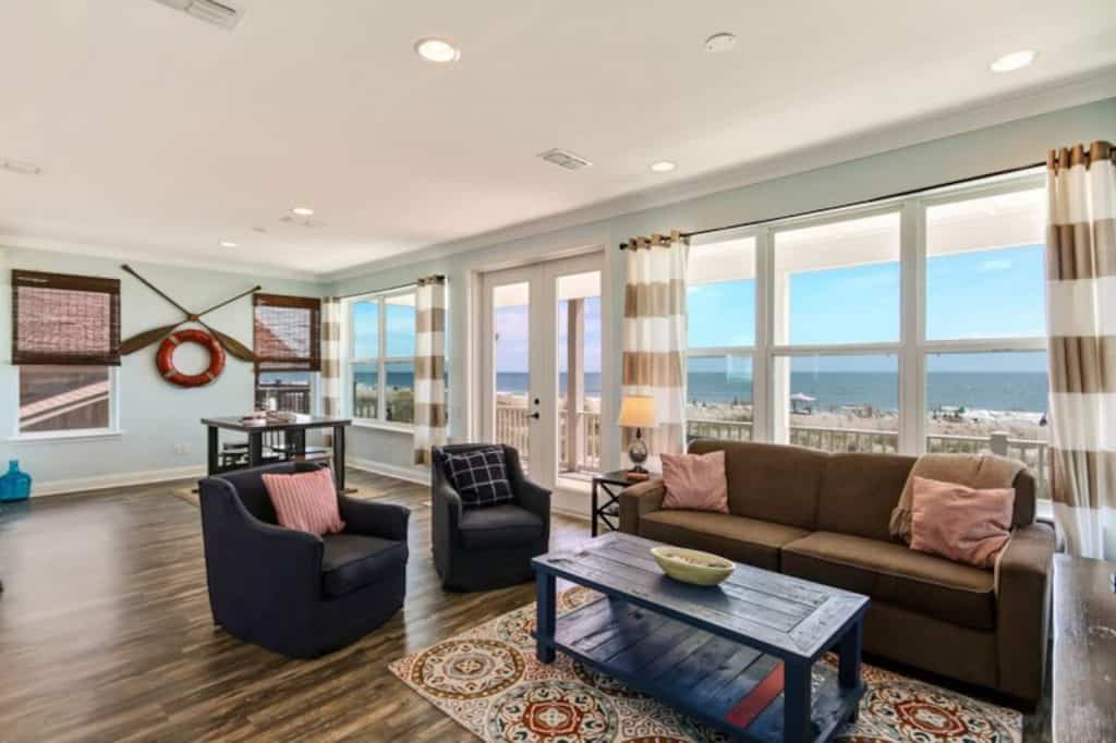 Photo of the living room inside a modern and spacious beach house Airbnb.