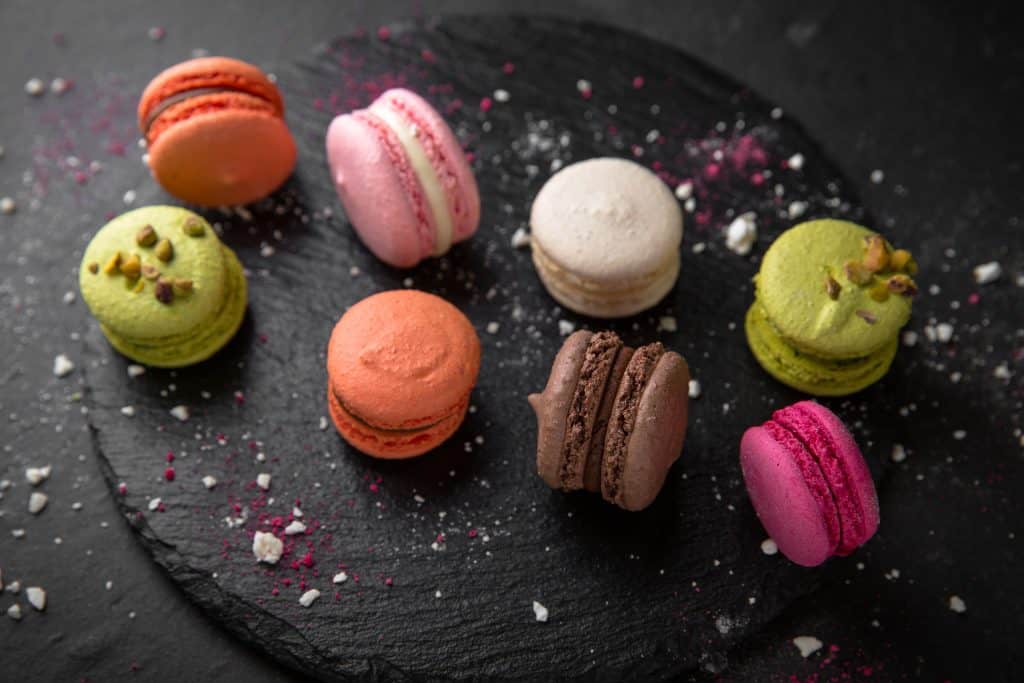 A series of macrons, served alongside the best coffee in Miami.