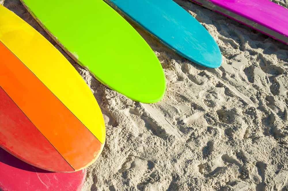 Rainbow surfboards on a beach
