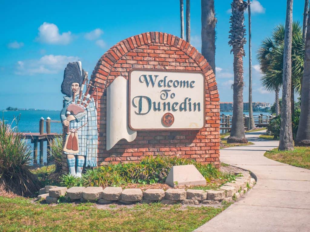 A Scotsman statue playing the bagpipes welcomes guests into the city of Dunedin, one of the cutest small towns in Florida.