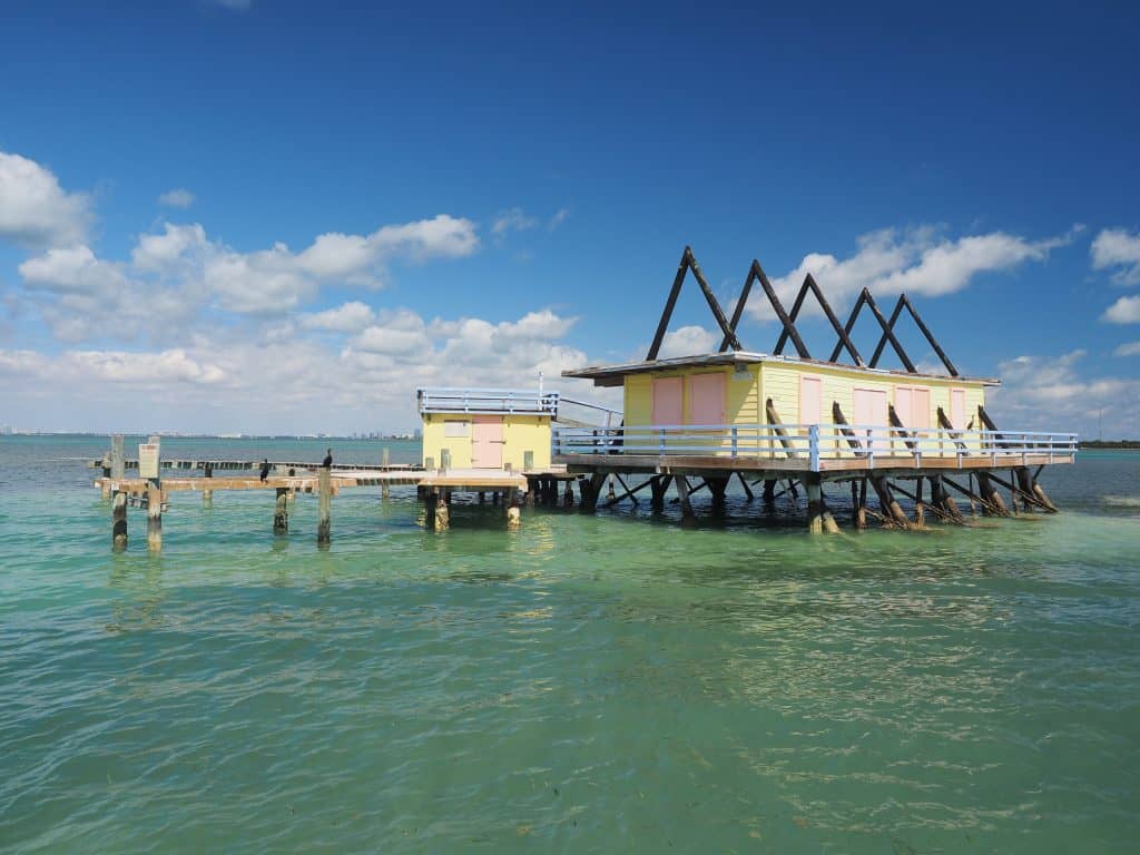 A colorful abandoned home in the water town of Stiltsville, one of the best things to do in the Keys.