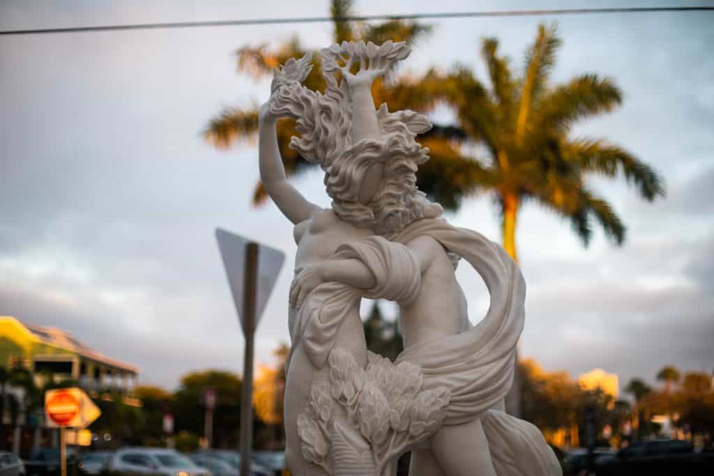 A statue stands in St. Armand's Circle, a beautiful are renowned for its architecture, one of the best things to do in Siesta Key.