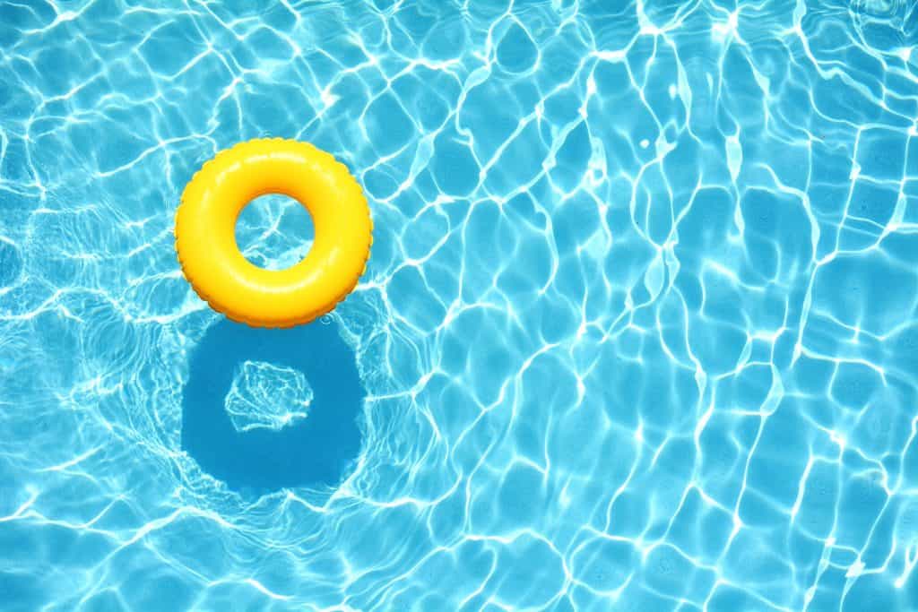 A yellow tube in a swimming pool.