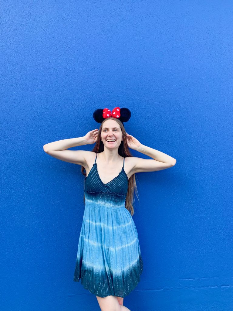 Head to Disney World to spot one of the Insta-worthy walls where a girl is posing on a blue wall with mickey ears