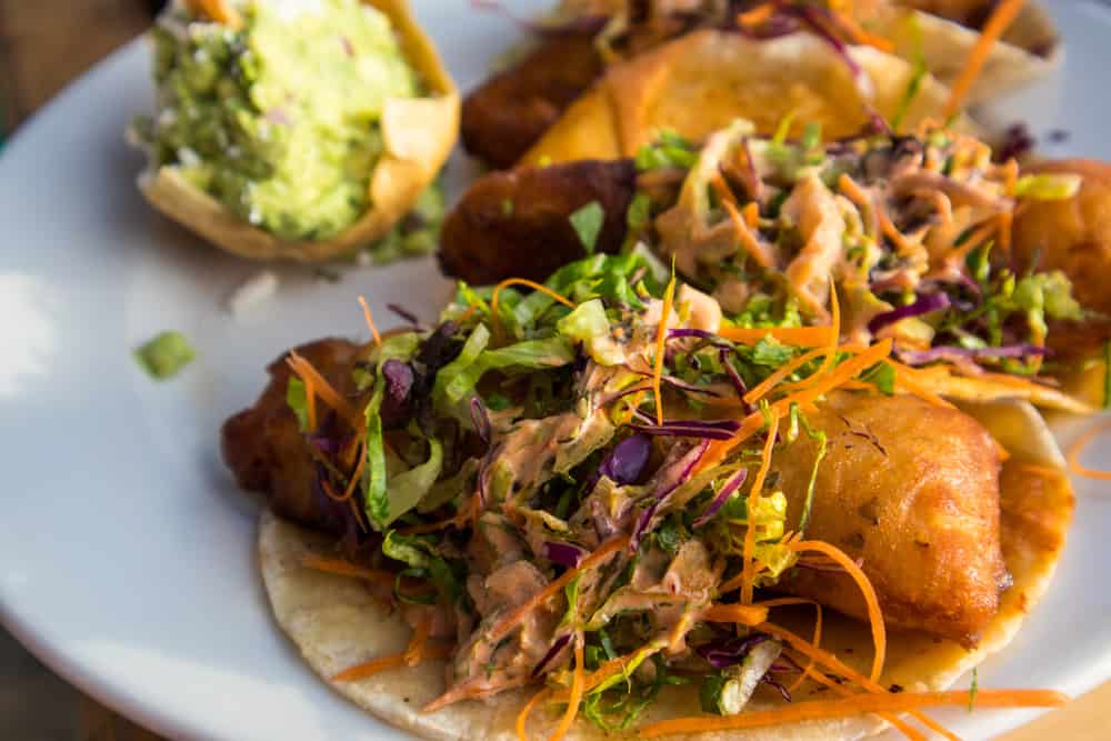 Tacos with fried fish and slaw on a plate