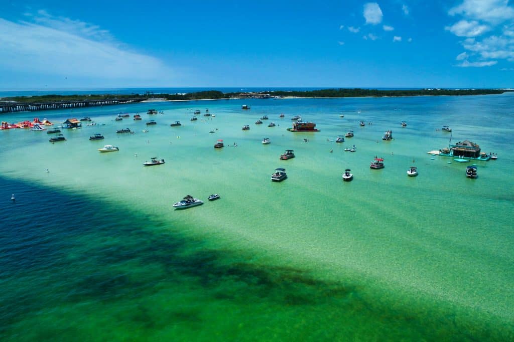 The clear blue-green waters of Crab Island, Florida glitter in the sunlight.
