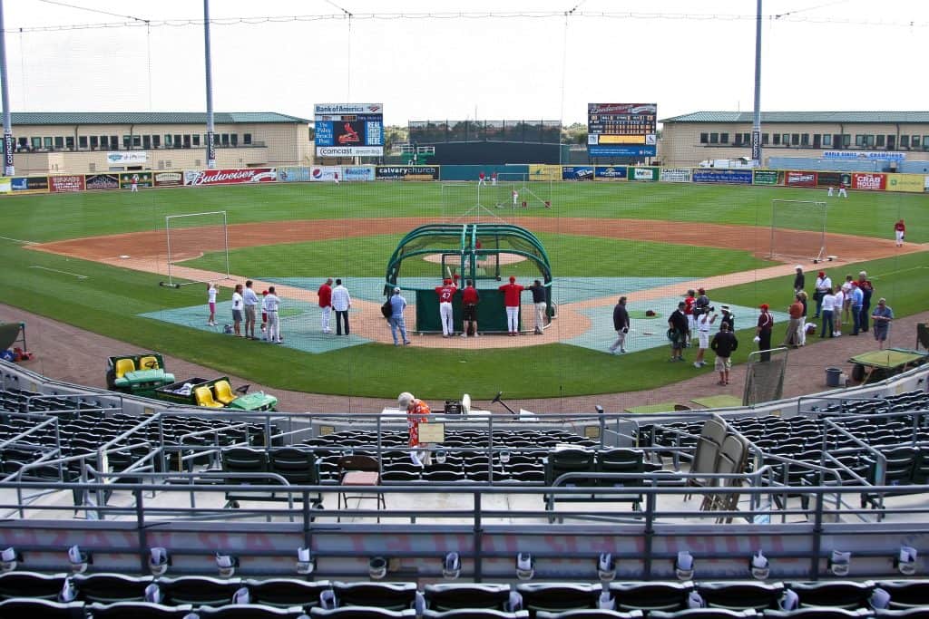 Players scrimmage behind home plate at Roger Dean Stadium