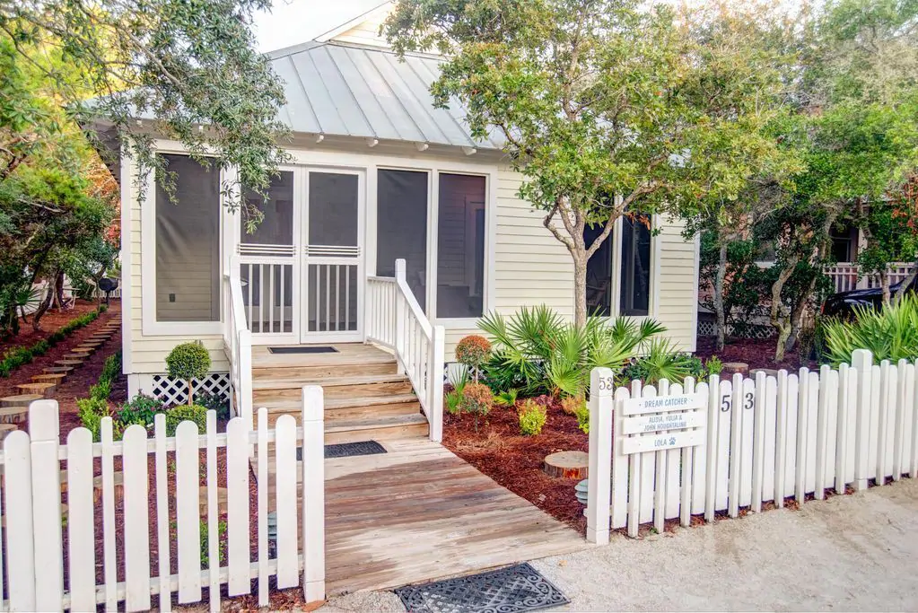 White picket fence and a white house one of the Seaside Florida rentals