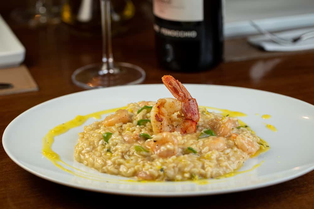 plate of shrimp risotto that you can eat at one of the restaurants on Anna maria
