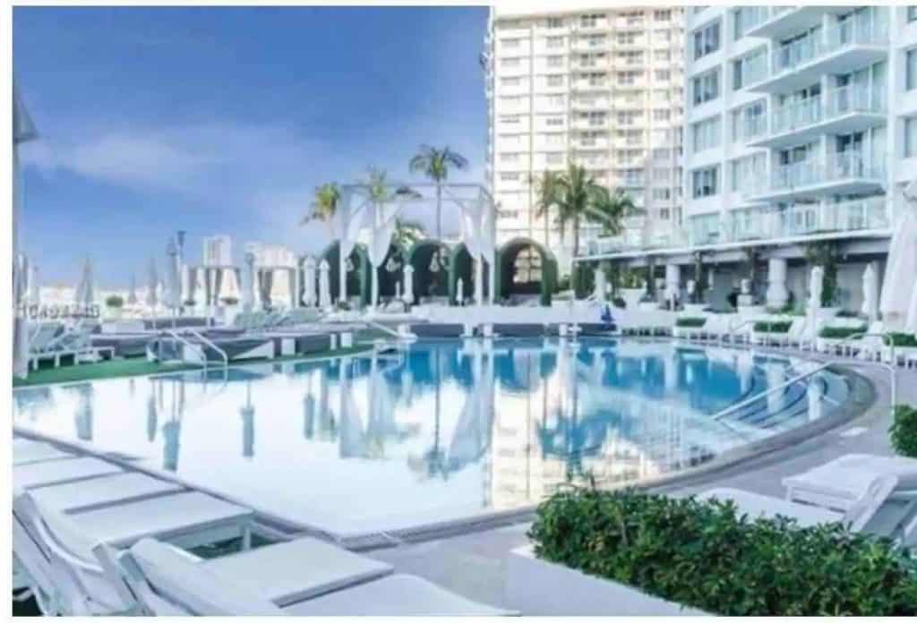 Photo of luxury resort style pool at a 5 star hotel studio condo Airbnb in Miami.
