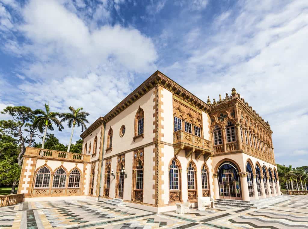 historic style building with pale pink and gold exterior and intricate tiles