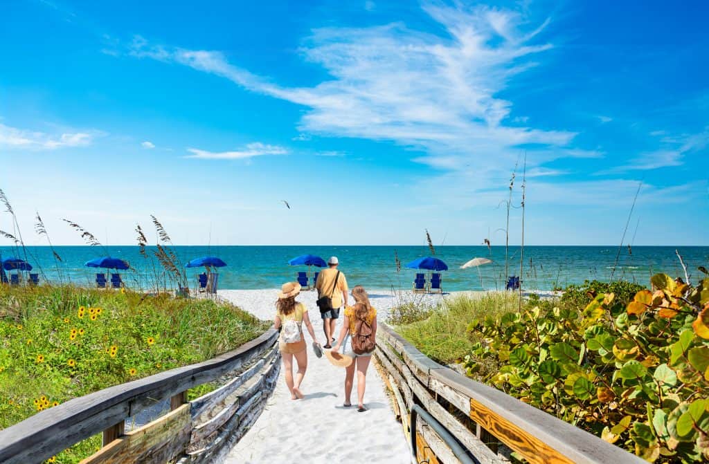 Hidden Gems Florida beachgoers walk on Caladesi Island.