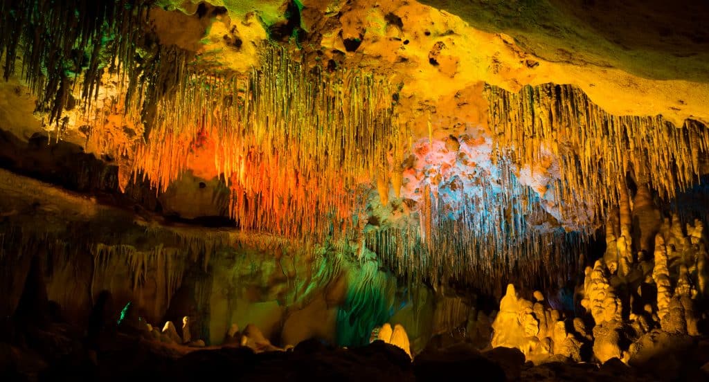 A  cavern rock formations of limestone illuminated by lights is one of the hidden gems in Florida you can visit underground