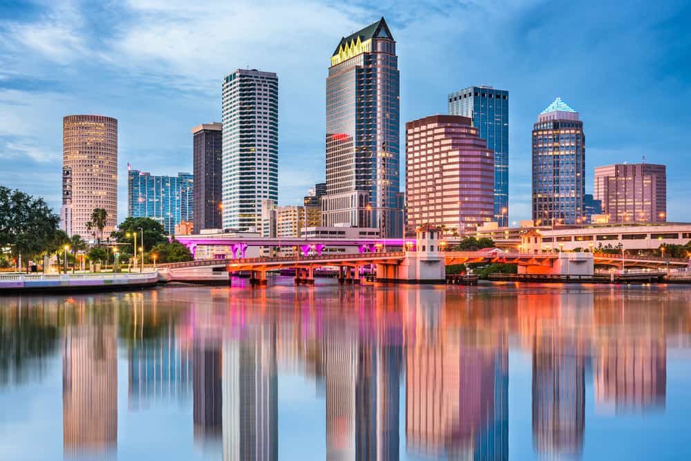Highrise buildings and bridges reflected in the water of downtown Tampa, a popular place for weekend getaways in Florida.