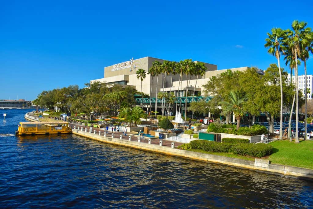 The view of the breezeway and outdoor lobby of the STRAZ Center as seen from the Hillsborough River, one of the best things to do in Tampa.