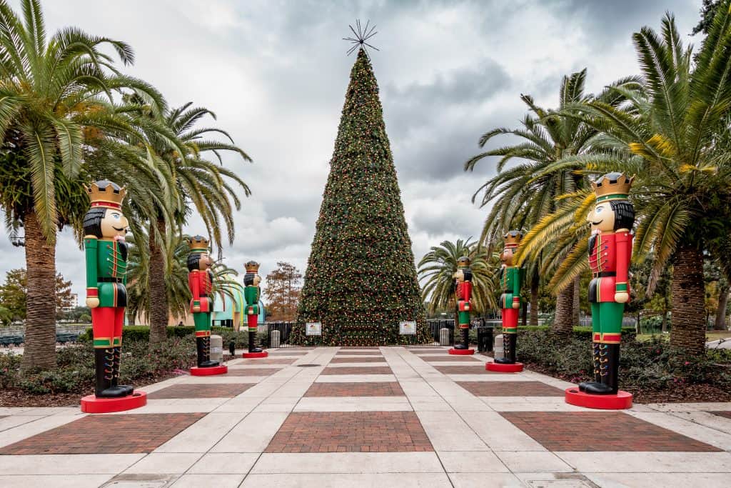 The 72-foot tree at Eola Park is guarded by larger than life Nutcracker soldiers during Christmas in Orlando.