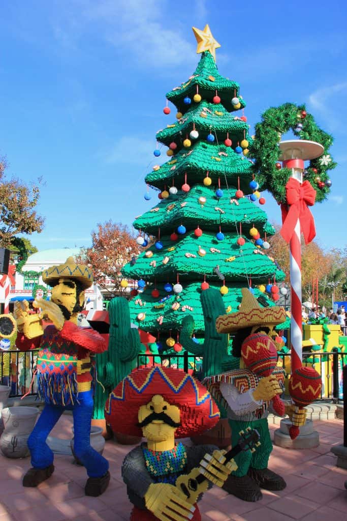 A Lego mariachi band plays in front of the Lego Christmas tree, at Legoland's Christmas Bricktacular, one of the best things to do in Orlando for Christmas.