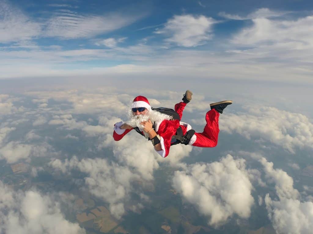 A skydiving Santa plummets to the ground during Christmas in Orlando.