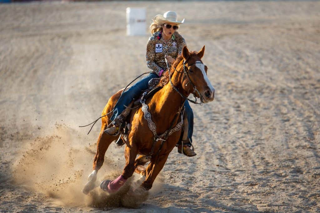 An exhibitionist rides a horse in the area at the Homestead Rodeo, one of the rowdiest festivals in Florida.