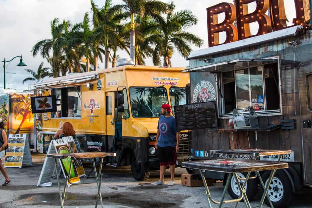 Food vendors line Margate Blvd for the Sounds of Sundown Festival, a weekly festival in Florida.