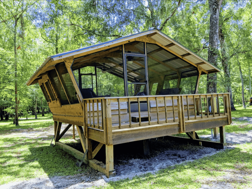 The open-air building, the birdhouse, is a perfect place for glamping in Florida.