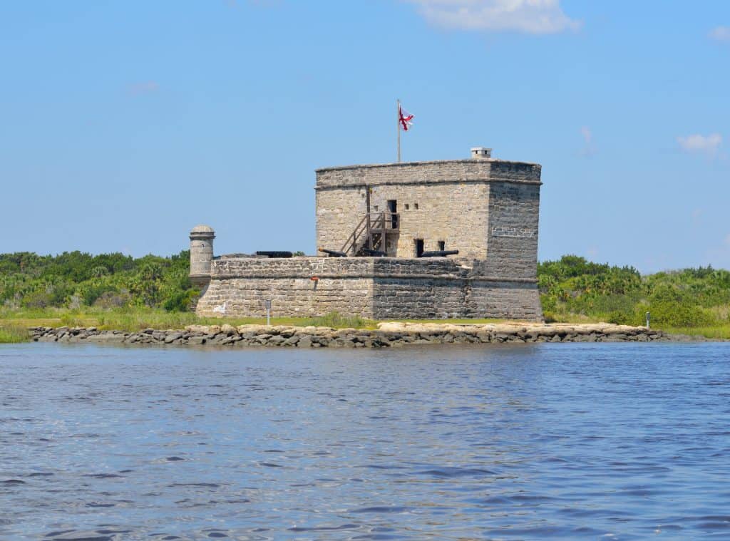 Photo of the stone structure of Fort Matanzas National Monument  surrounded by calm waters