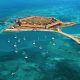 Aerial photo of Fort Jefferson surrounded by the endless blue waters of Dry Tortugas National Park, one of Florida's National Parks